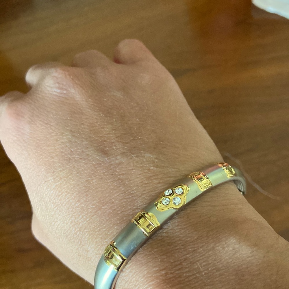 Silver and gold tone hinged bracelet